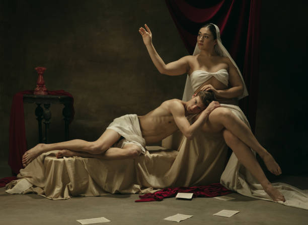 istock Modern remake of classical artwork - young medieval couple on dark background, comparison of eras concept 1301042388