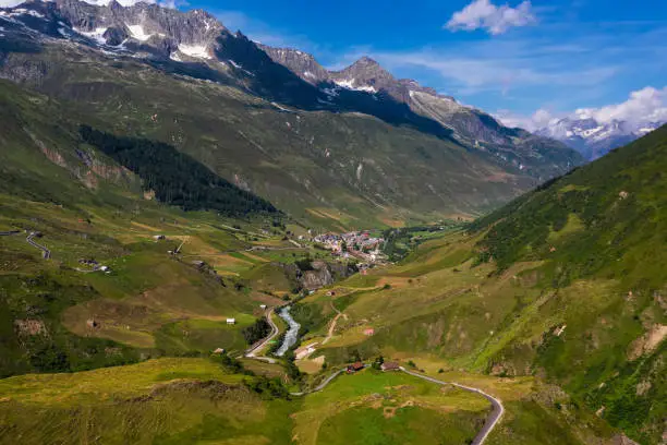 Aerial view of the Realp village and the Reuss river in the canton of Uri, Switzerland. This municipality is located on the rise into the Furka Pass in the Swiss Alps.