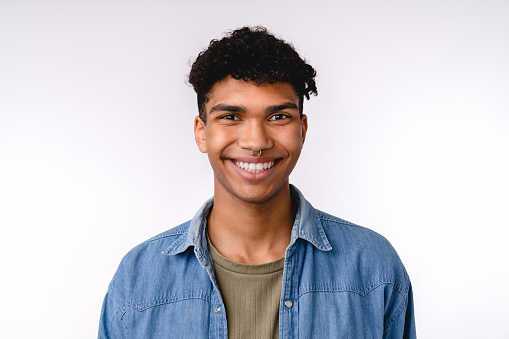 Portrait of a young afro man in casual attire isolated over white background
