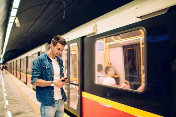 istock Thoughtful man surfing mobile phone in underground 1301044284