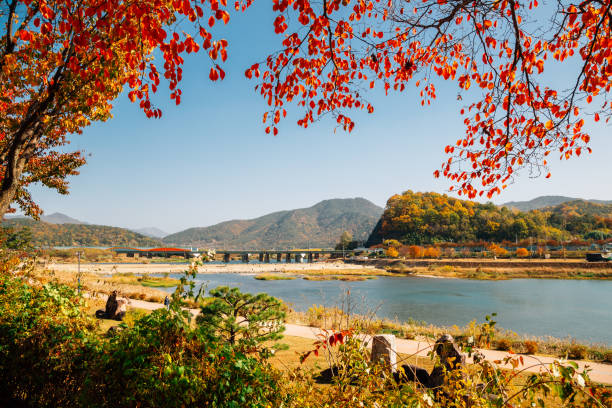 istock Miryang river and mountain at autumn in Miryang, Korea 1301045233
