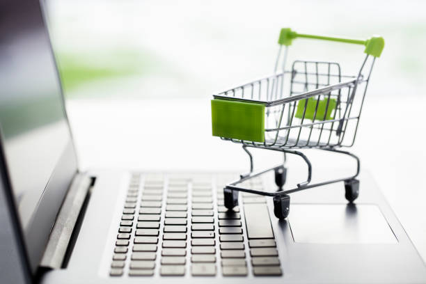 shopping cart on laptop computer, web store or shop concept for online shopping and home delivery - shopping basket imagens e fotografias de stock