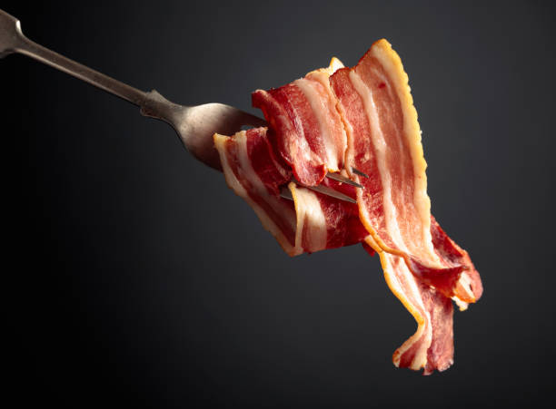 istock Slices of tasty fried bacon. 1301045812