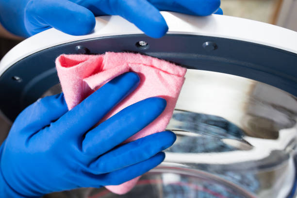 istock Clean the washing machine. Washing machine maintenance rules 1301047502