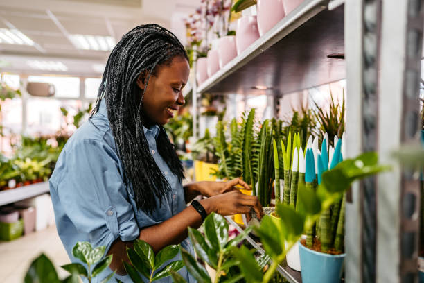 istock Woman at a flower shop 1301047866