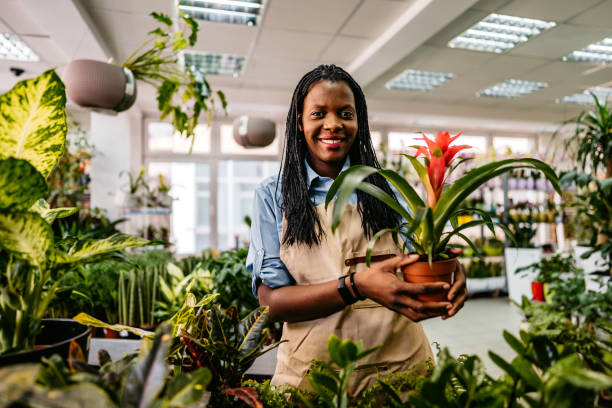 istock The florist standing in flower shop 1301048185