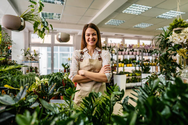 istock The florist standing in flower shop 1301048250
