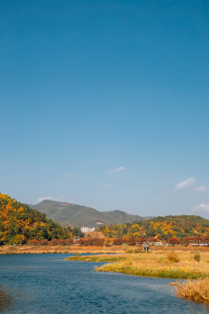 istock Miryang river and mountain at autumn in Miryang, Korea 1301049235