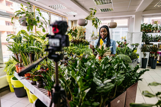 istock Female florist worker vlog recording 1301049380