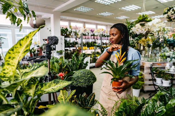 istock Female florist worker vlog recording 1301049404