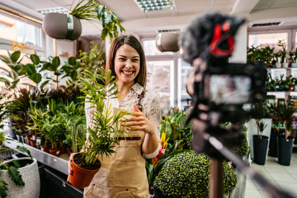 istock Female florist worker vlog recording 1301049432