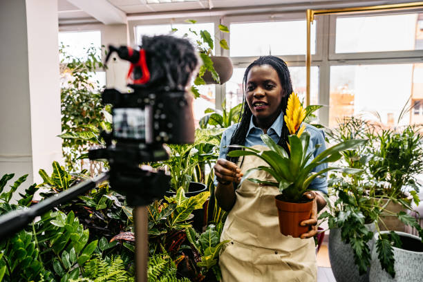 istock Female florist worker vlog recording 1301049458