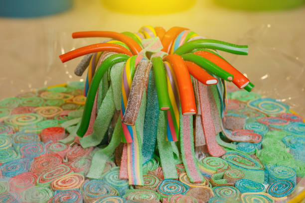 istock Sweet gummy multicolored sticks on a funfair stand 1301050344