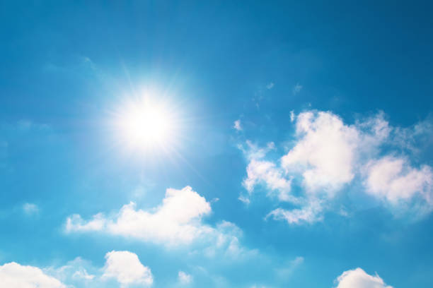 istock Bright blue sky and sun flare in spring sky with clouds vapor. 1301050688