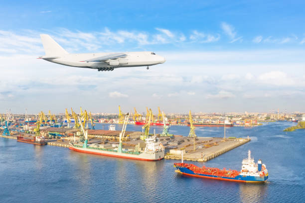 istock Huge freight airplane landing approach over the cargo seaport. 1301050879