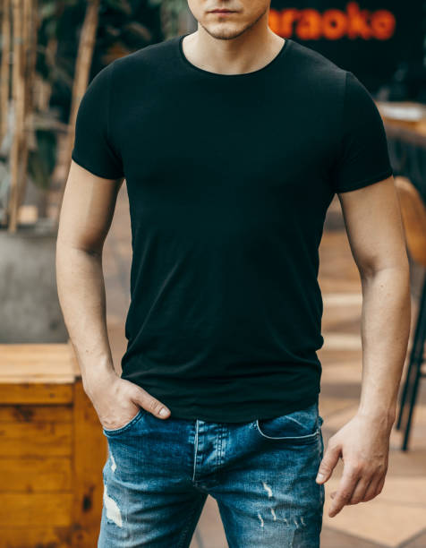 istock Stylish muscular men wearing black t-shirt posing in studio 1301050978