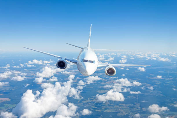istock Airplane is flying in clouds. Concept aviation air transport. 1301050994