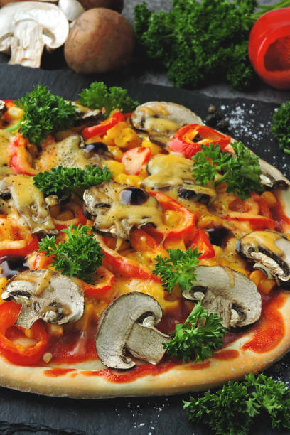 istock Vegan pizza with mushrooms, vegetables and herbs. 1301052050