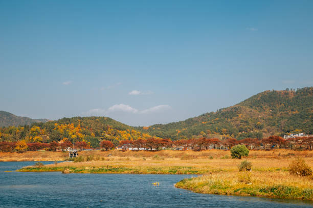 istock Miryang river and mountain at autumn in Miryang, Korea 1301055531