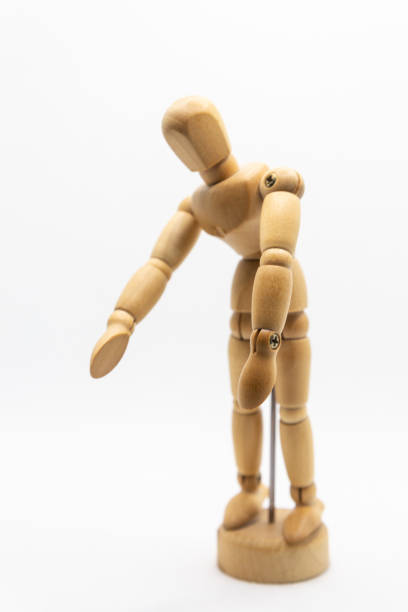istock wooden drawing mannequin slightly inclined on white background 1301056444