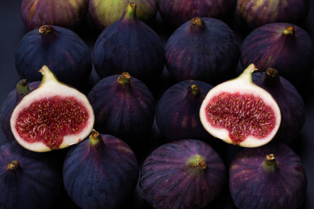istock Tasty figs on a black background. Top view. 1301056811