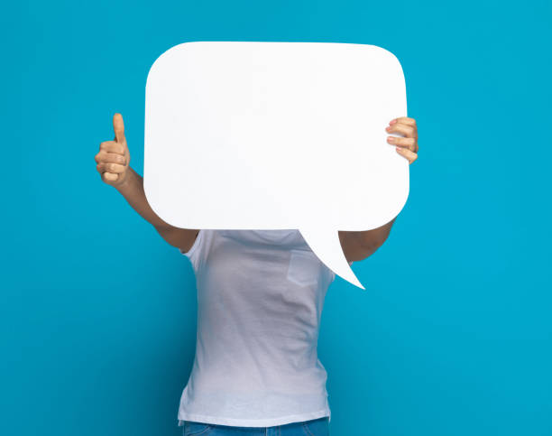 istock casual woman hiding behind a speech bubble 1301057061