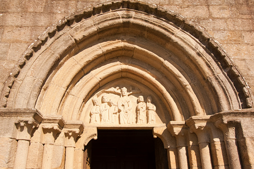 Colegiata de Iria Flavia,  Santa María a Maior church, initially set in XI century, Padrón , A Coruña province, Galicia, Spain. Camino de Santiago, camino portugués.  Close-up view of monumental doorway arcade.