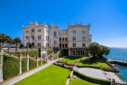 The Miramare Castle is a 19th-century castle facing directly on the Gulf of Trieste, with grounds that include an extensive cliff and a seashore park.