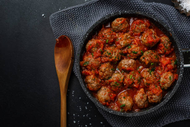 istock Roasted meatballs with tomato sauce 1301059683
