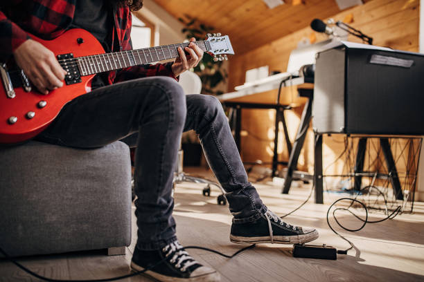 istock Male guitarist playing electric guitar 1301062133