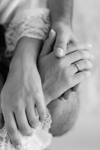 istock the bride and groom tenderly hold hands between them love and relationships 1301063376