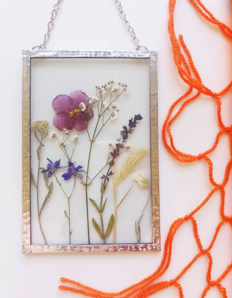 istock Framed pressed flowers in tiffany technique in stained glass 1301063924
