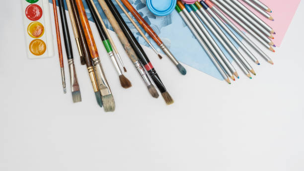istock Art composition with brushes, paints and pencils. Multicolored composition of artistic themes. 1301068201