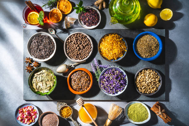istock Assorted tea and herbs infusion on black slate tray 1301068204