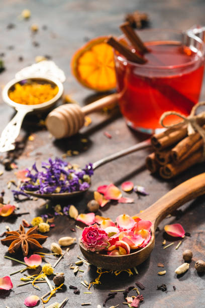 istock Black tea cup and herbal tea featuring rose petals tea and mallow 1301068338