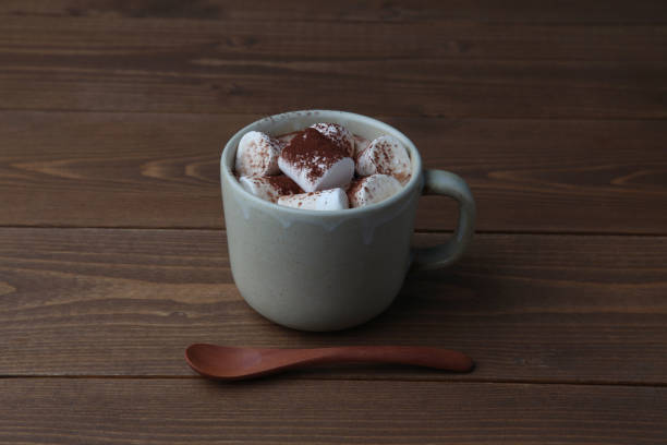 istock hot chocolate with marshmallows isolated on wooden table 1301068354