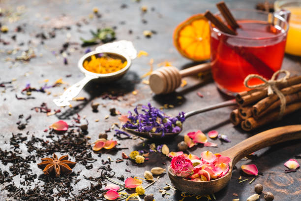 istock Black tea cup and herbal tea featuring rose petals tea and mallow 1301068505