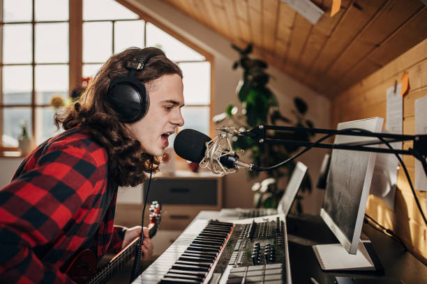 istock Male artist making music in recording studio 1301069349