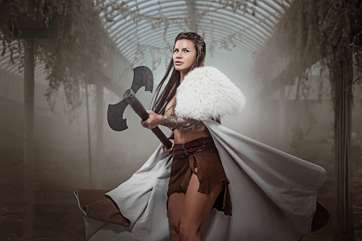 Beautiful brunette Sword wielding viking warrior female