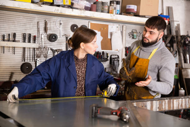 istock Woman working with metal sheet and using measuring tape 1301069493