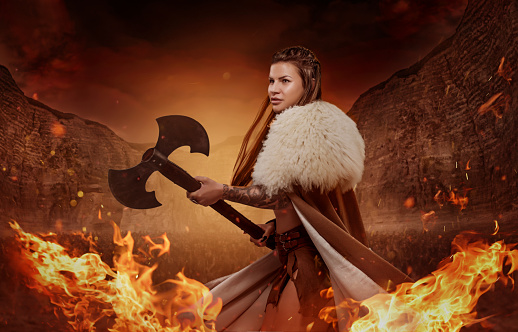Viking inspired warrior female in a fire storm