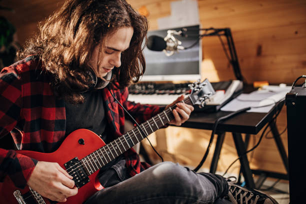 istock Male artist making music in recording studio 1301069827