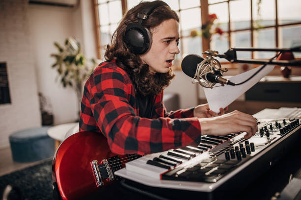 istock Male artist making music in recording studio 1301069862