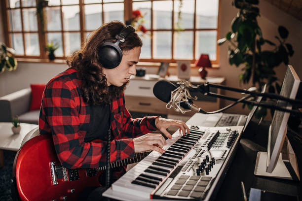 istock Male artist making music in recording studio 1301069948