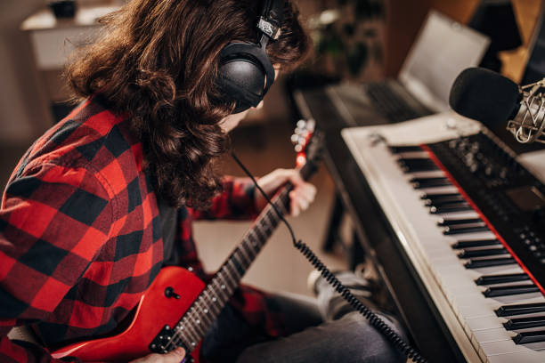 istock Male artist making music in recording studio 1301069990