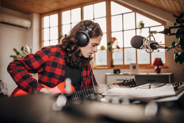 istock Male artist making music in recording studio 1301070005