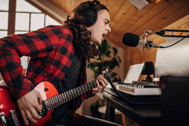 istock Male artist making music in recording studio 1301070052