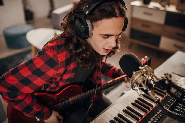 istock Male artist making music in recording studio 1301070069