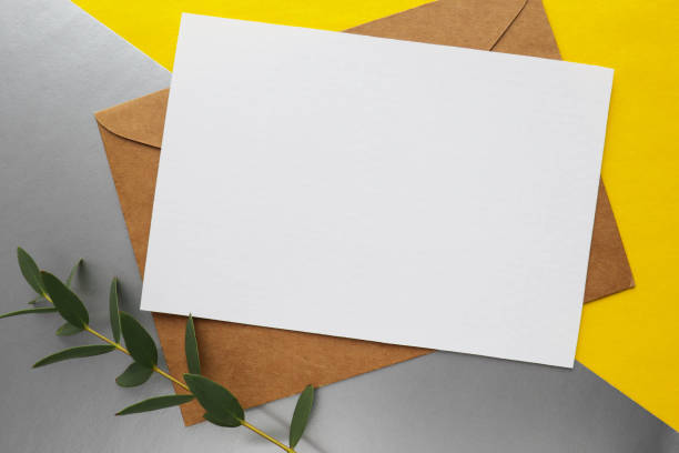 istock white envelope on a gray and yellow background. invitation 1301070844