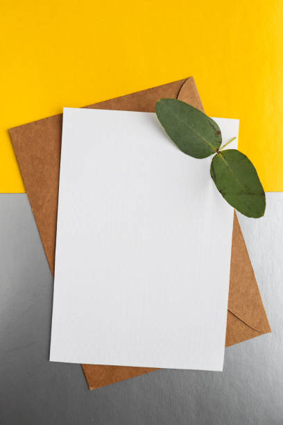 istock white envelope on a gray and yellow background. invitation 1301070855
